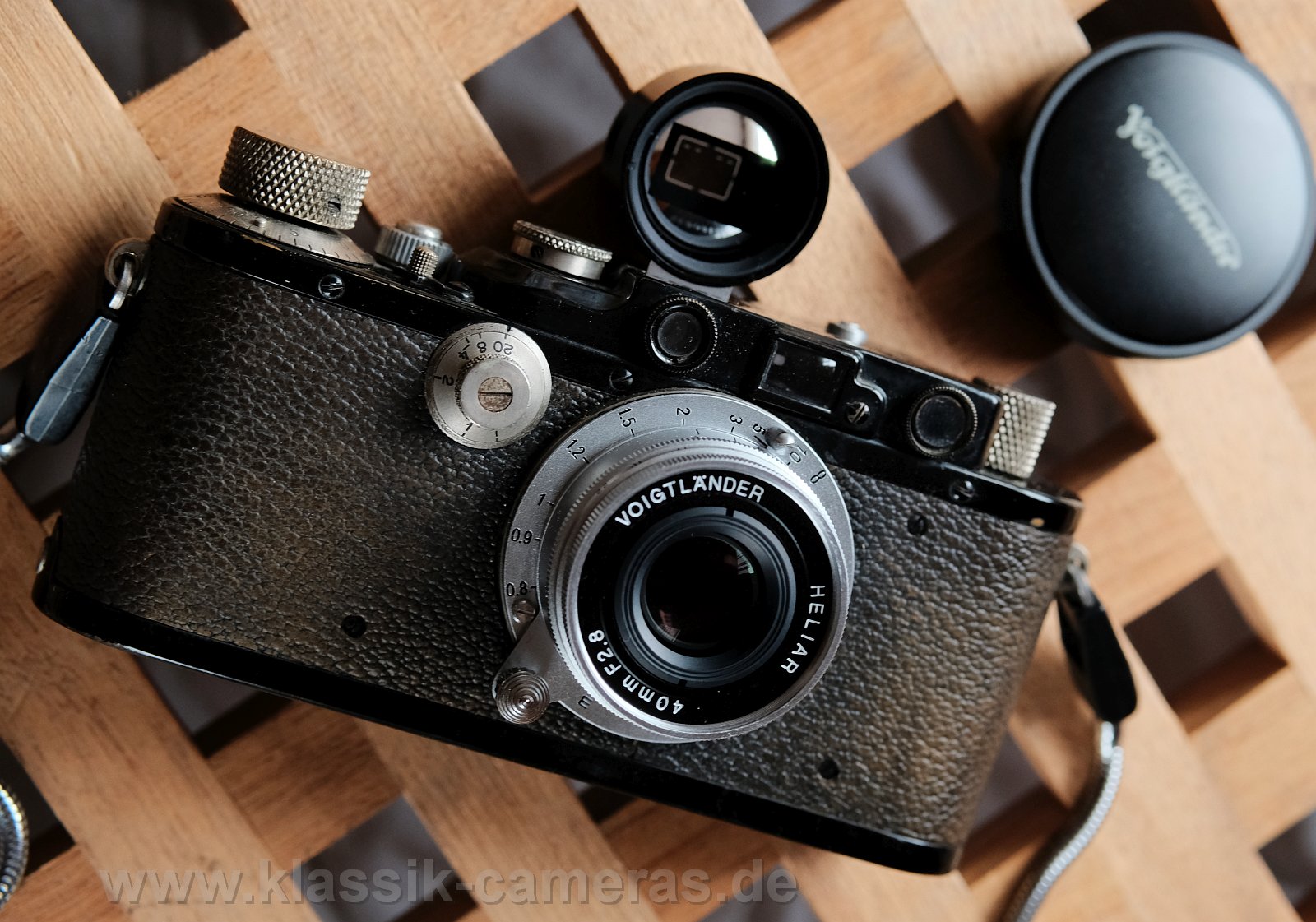 Leica III /1933 w.
          Voigtlander Heliar 40/2.8 and "M" 40mm finder